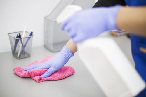 Carpet cleaning technician using protective equipment during a safety-focused service
