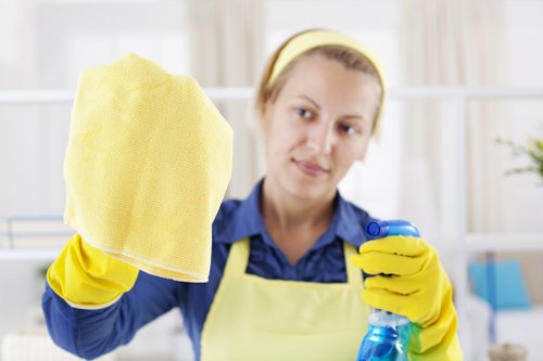Team member preparing carpet cleaning tools with attention to workplace safety