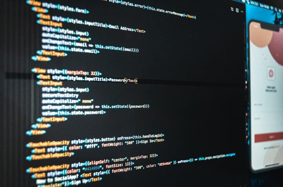 Close-up view of a computer screen displaying lines of code in a software development environment, with a dark background and colorful syntax highlighting. The code includes various tags, symbols, and